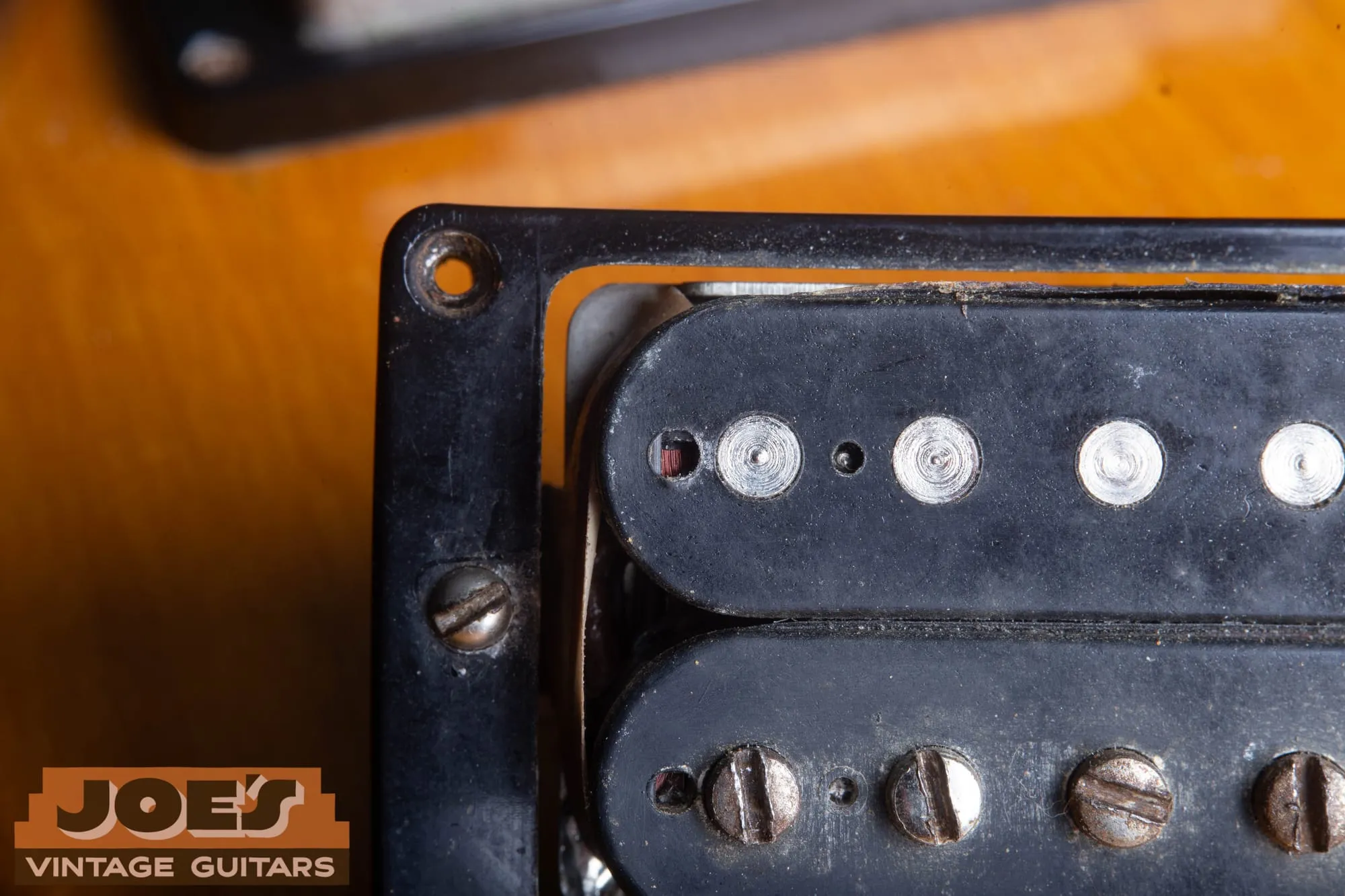Close-up through the tooling holes of an uncovered PAF showing the purple brown plain enamel winding wire.