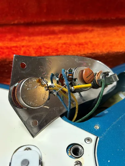 Original electronics and untouched solder joints inside the 1966 Fender Jaguar, verifying factory-original wiring and finish