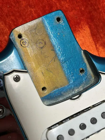 Neck pocket of the Lake Placid Blue Fender Jaguar showing the original paint stick marks used to authenticate the factory custom color finish
