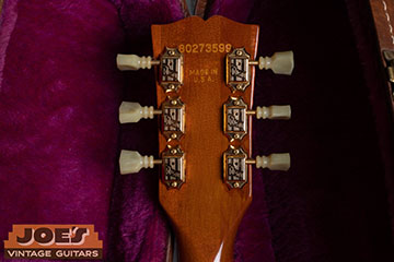 1983 Gibson ES-335 headstock showing serial number stamped directly into the wood