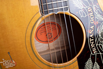 Vintage Gibson guitar interior label showing serial number on paper label inside the body